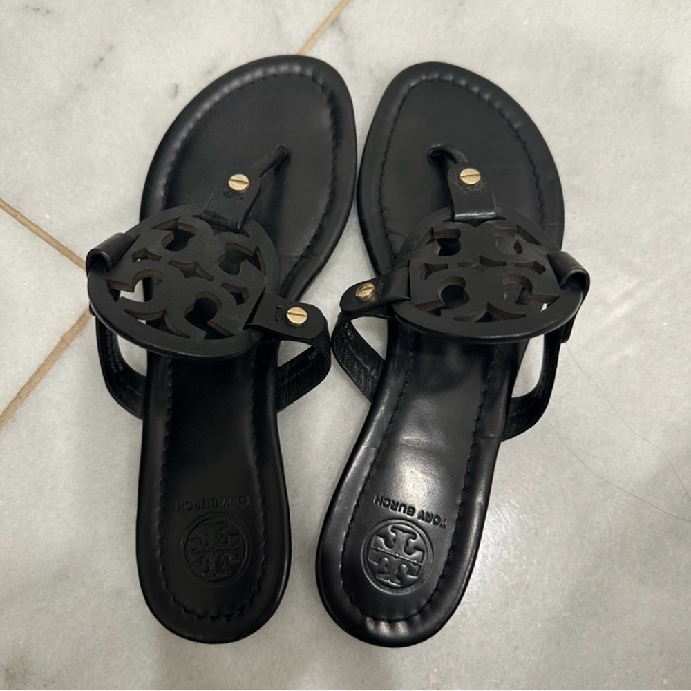 Two pairs of Tory Burch sandals.